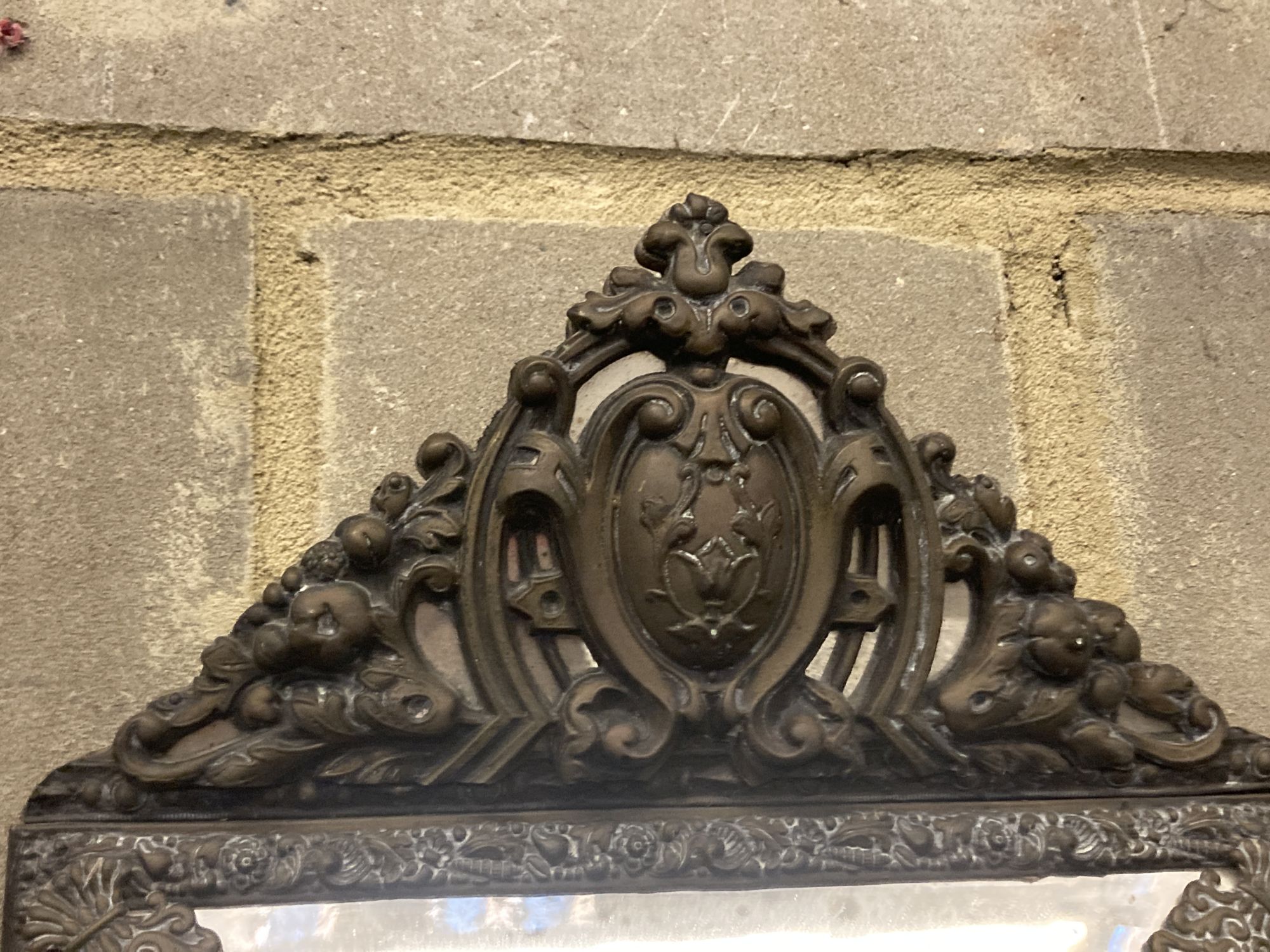 A 19th century French embossed brass wall mirror, width 33cm, height 54cm